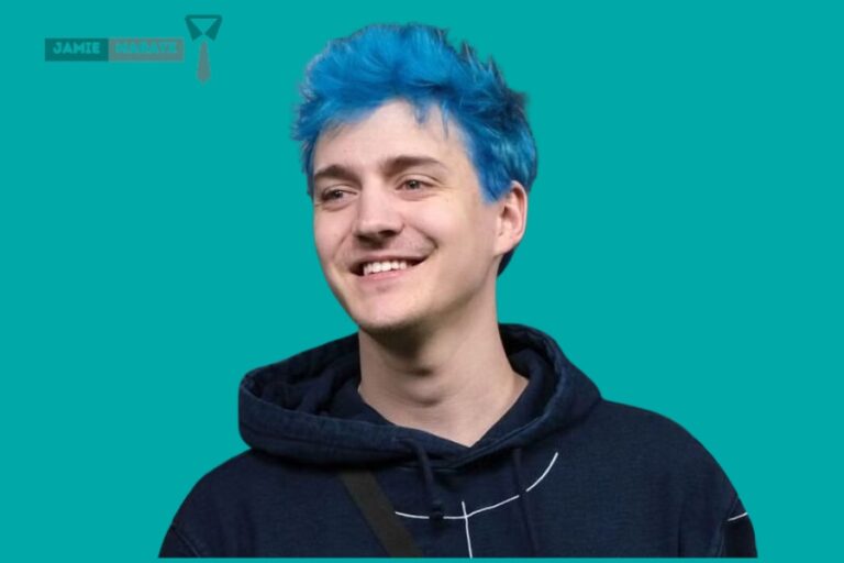 Ninja Net Worth: Tyler "Ninja" Blevins smiling with his iconic blue hair, representing his $50 million success story in 2024.