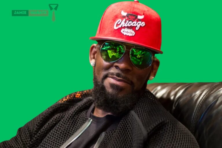 R. Kelly wearing a red Chicago cap and sunglasses, representing the theme of the blog post titled "R. Kelly Net Worth.