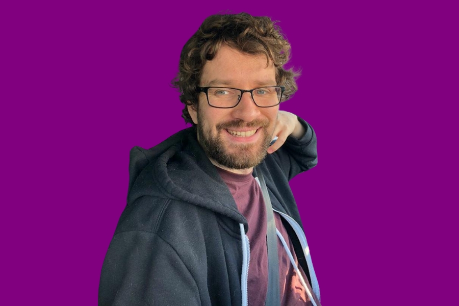 Political streamer Destiny smiling during a livestream, central to the destiny deplatforming controversy