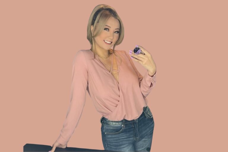 Gina Darling smiling in a pink top, representing her involvement in the gina darling twitch ban controversy