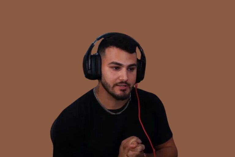 Fedmyster wearing headphones and speaking while streaming